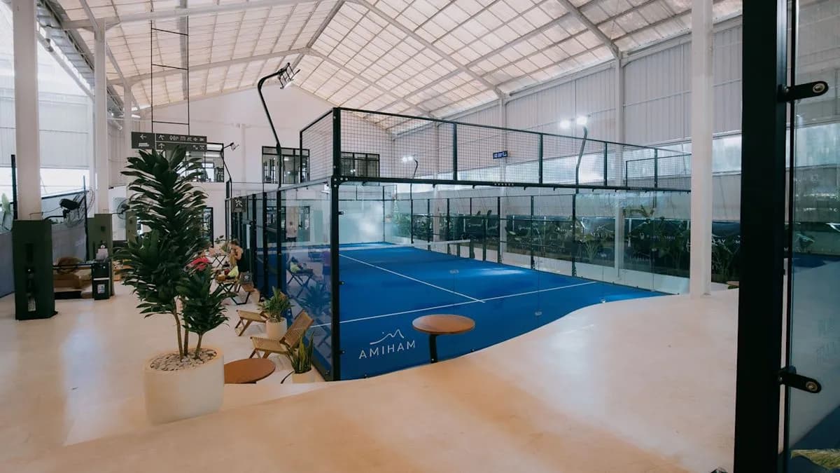 Blue covered padel courts at Mahima Tennis, Padel & Gym