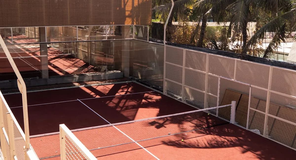 Outdoor terracotta padel court at Nusa Padel Club By The Beach