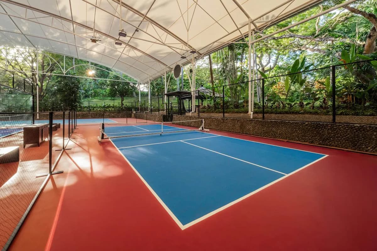 Roofed doubles padel court at Trinity Courts at The Laguna Bali