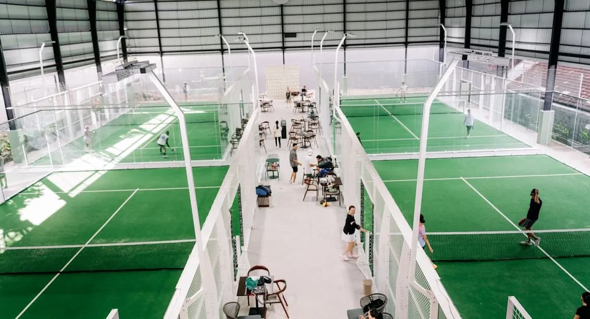 Indoor green padel courts at Casa Padel Bali