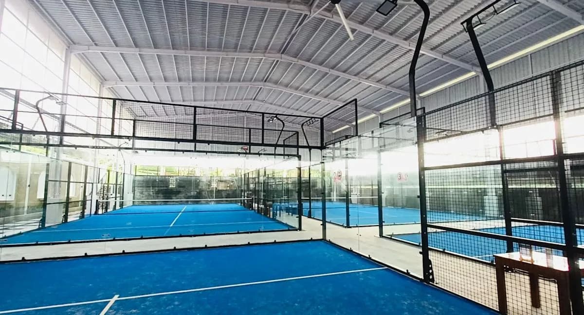 Blue roofed padel courts at Flamingo Padel Bali