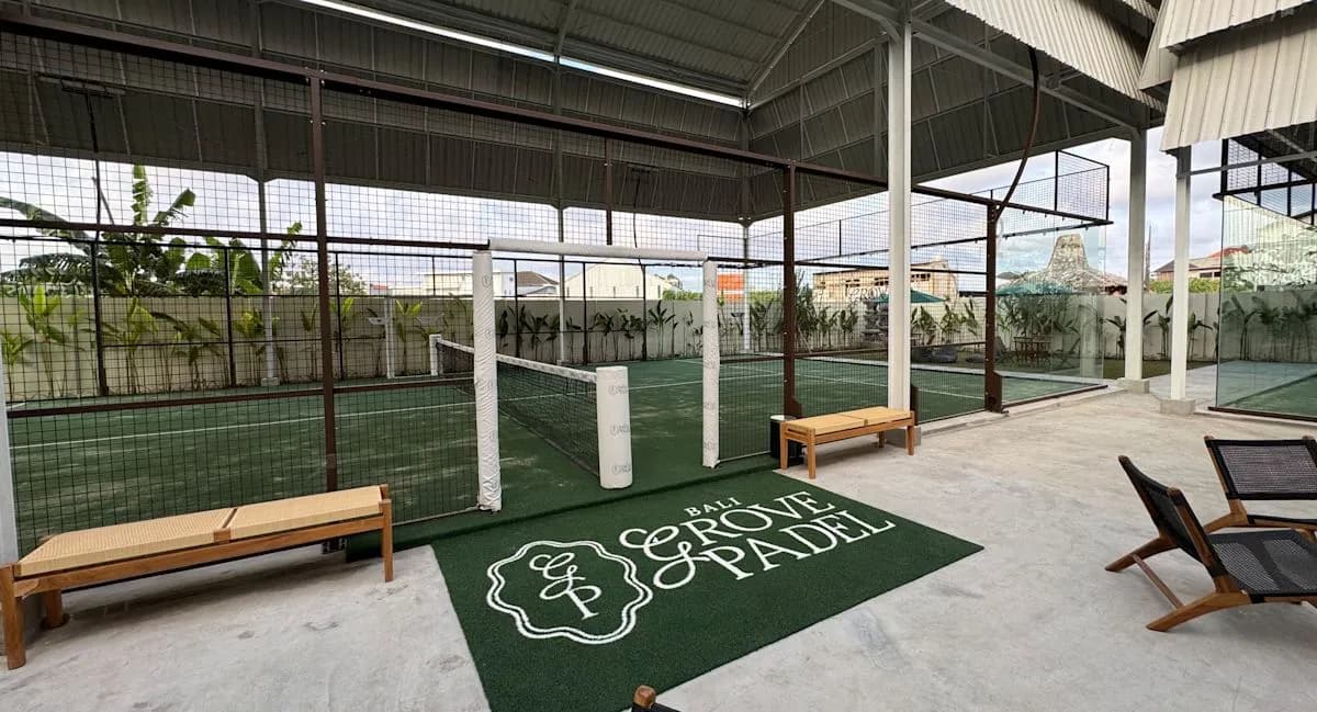 Padel courts beside the seating area at Grove Padel