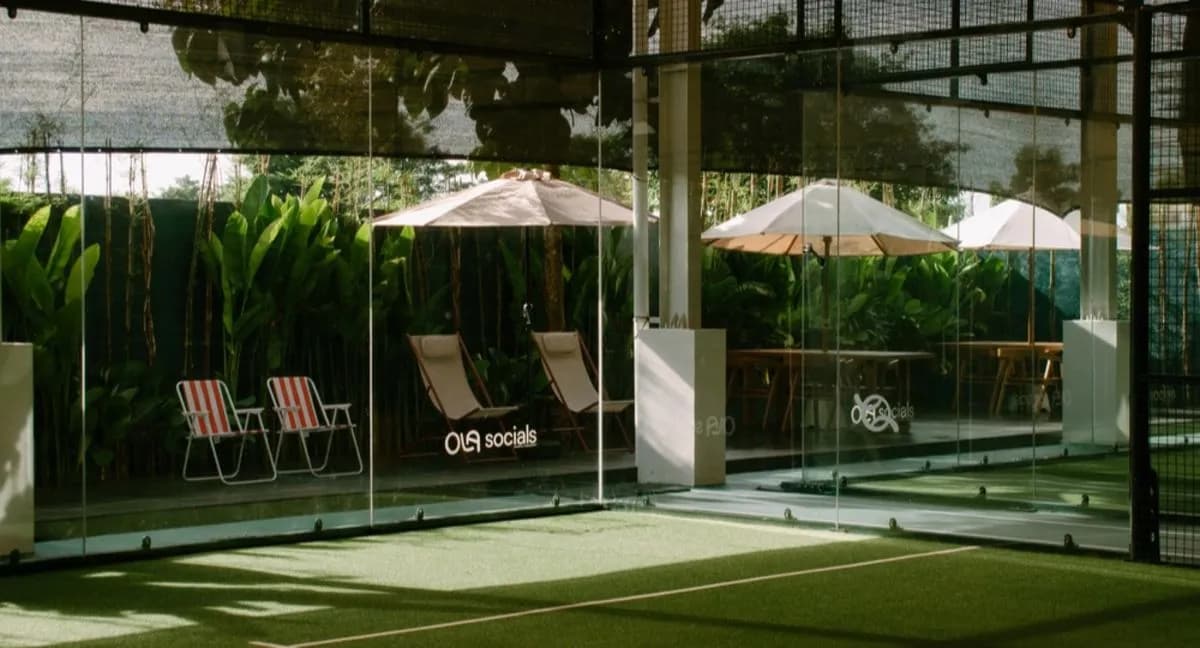 Green indoor padel court at OLA Socials